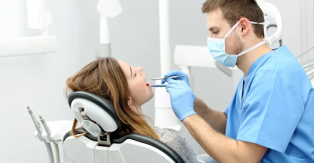 Doctor operating on patient to Avoid Abrasive Tooth Cleaning Medium